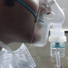 Picture of man wearing a nebulizer mask